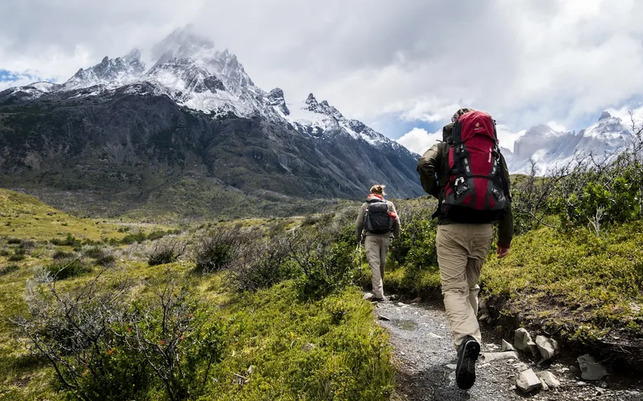 Hiker crossing a mountain ridge